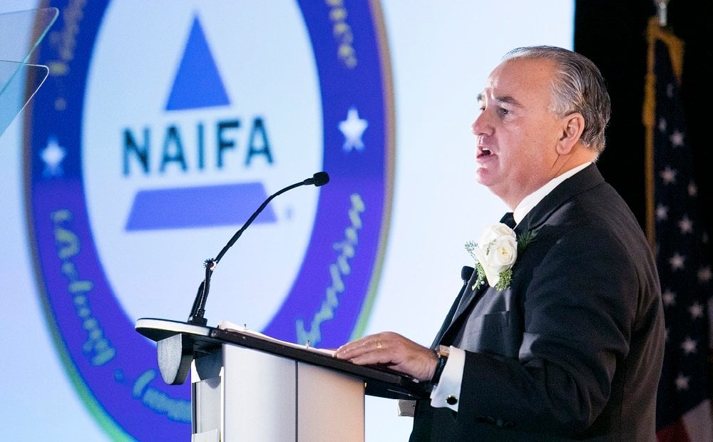 NAIFA President Larry Holzberg giving a speech